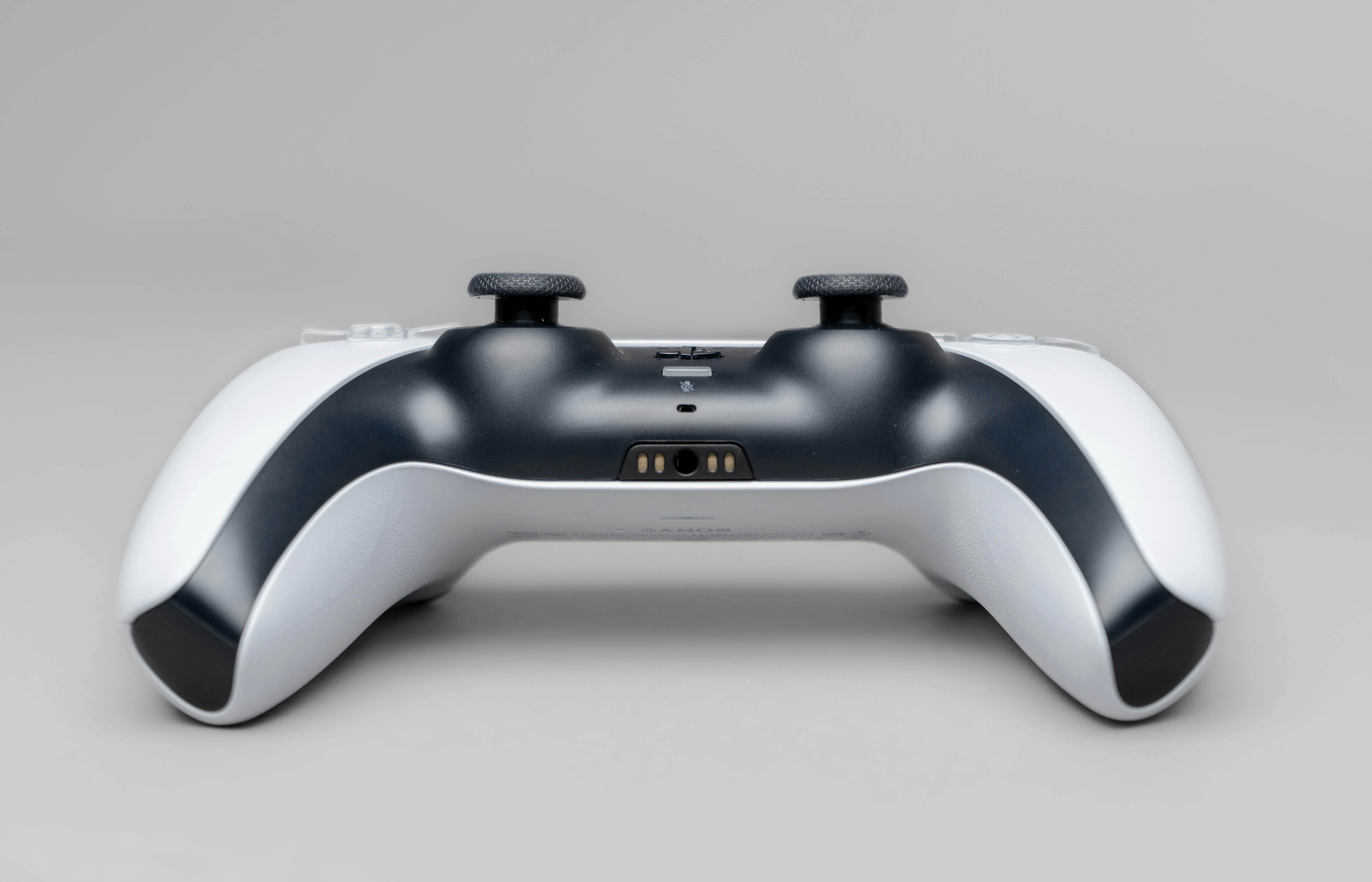 white and black game controller